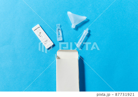 coronavirus salvia self testing kit on blue 87731921