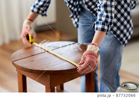 woman with ruler measuring table for renovation woman with ruler measuring table for renovation 87732066