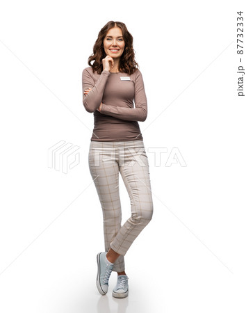 happy female shop assistant with name tag happy female shop assistant with name tag 87732334
