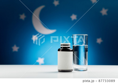 glass of water and soporific medicine at night glass of water and soporific medicine at night 87733089