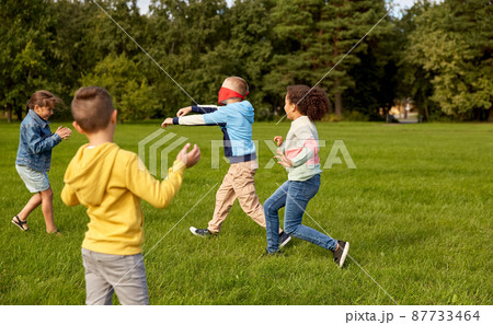 happy children playing and running at park 87733464