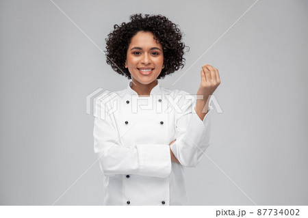happy female chef showing gourmet sign happy female chef showing gourmet sign 87734002