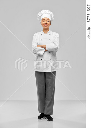 smiling female chef in white jacket 87734307