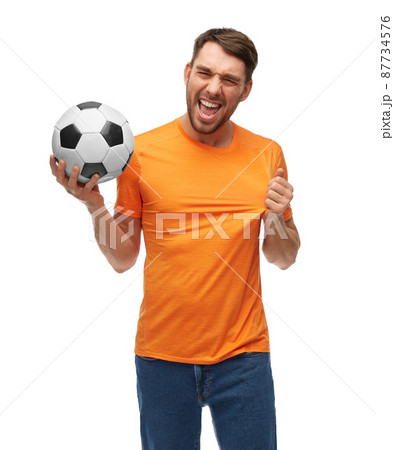happy smiling man or football fan with soccer ball happy smiling man or football fan with soccer ball 87734576