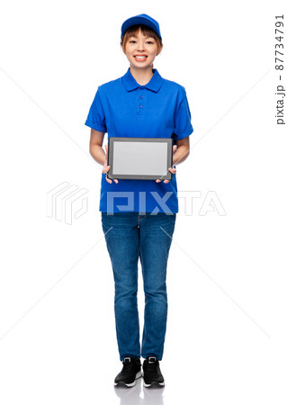 delivery woman in blue uniform with tablet pc delivery woman in blue uniform with tablet pc 87734791