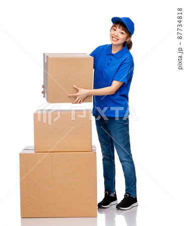 delivery woman in blue uniform with parcel boxes 87734818