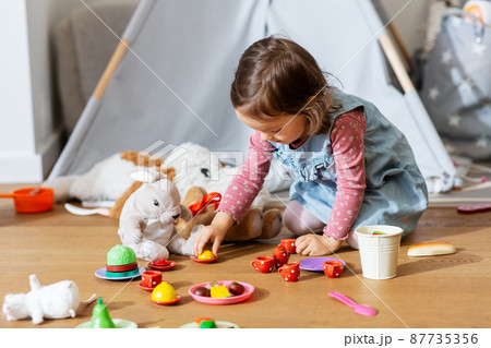 baby girl playing tea party with toys at home baby girl playing tea party with toys at home 87735356
