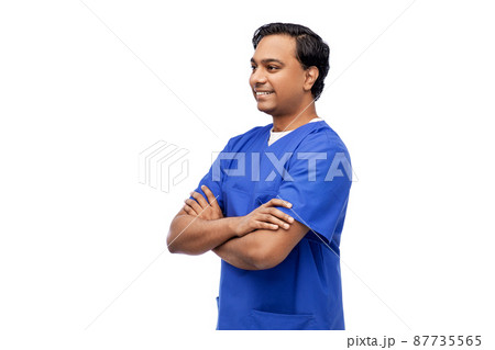 happy indian doctor or male nurse in blue uniform happy indian doctor or male nurse in blue uniform 87735565