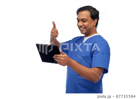 doctor or male nurse has video call on tablet pc 87735594