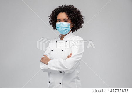 female chef in medical mask and jacket female chef in medical mask and jacket 87735838