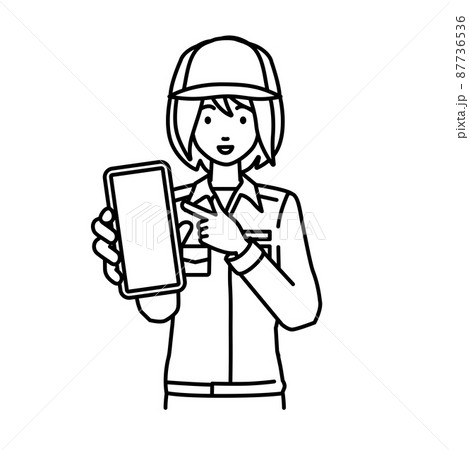 立ってスマートフォンを指差してこちらに向けて見せている作業員の女性 立ってスマートフォンを指差してこちらに向けて見せている作業員の女性 87736536