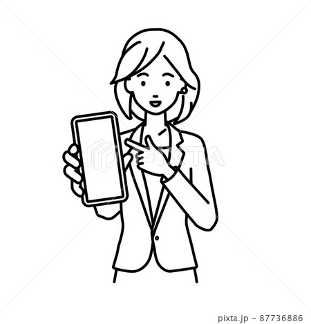 立ってスマートフォンを指差してこちらに向けて見せているスーツの女性 87736886
