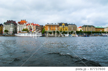 Panoramic view from the tourist boat on the pier with boats and the beautiful buildings of Stromkayen in the center of Stockholm Sweden Panoramic view from the tourist boat on the pier with boats and the beautiful buildings of Stromkayen in the center of Stockholm Sweden 87737600
