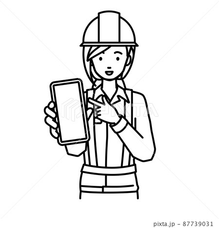立ってスマートフォンを指差してこちらに向けて見せている工事現場の女性 87739031