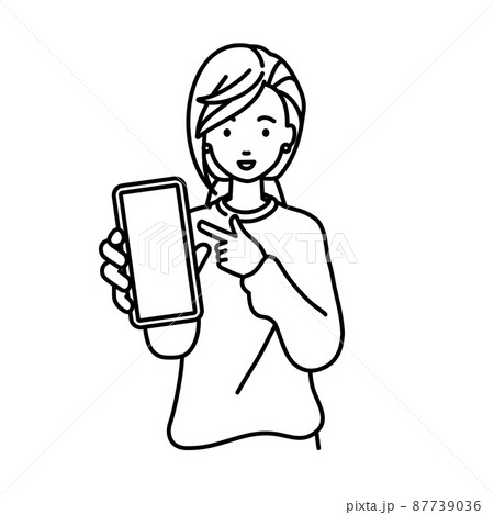 立ってスマートフォンを指差してこちらに向けて見せているリモートワークの女性 87739036