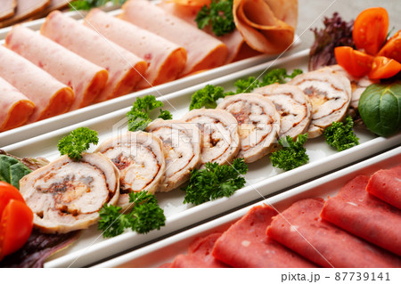 Platter of fresh meat cold cuts on table 87739141