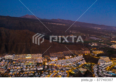 Top view of the houses located on the rock of Los Gigantes at sunset, Tenerife, Canary Islands, Spain 87740307