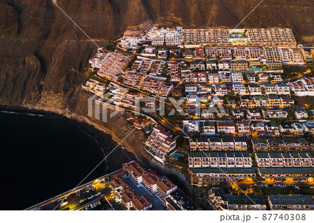 Top view of the houses located on the rock of Los Gigantes at sunset, Tenerife, Canary Islands, Spain 87740308