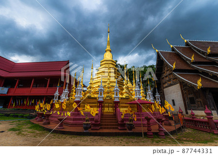 Beautiful Ancient golden color Pagoda in the Phan Tao temple  is a Buddhist temple in the historic centre tourist attraction an ancient Thai art and is Public places in Chiang Mai,Thailand. 87744331
