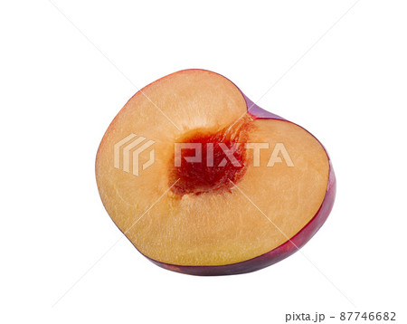 Half of smooth-skinned, purple plum fruit without kernel isolated on white background with copy space for text or images. Side view. Close-up. 87746682