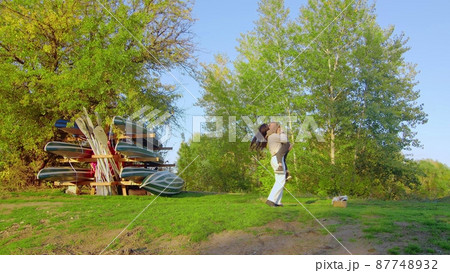 A happy family. The daughter runs to her mother in the forest park. happy family concept. Mom and daughter in the forest park. A happy family. The daughter runs to her mother in the forest park. happy family concept. Mom and daughter in the forest park. 87748932