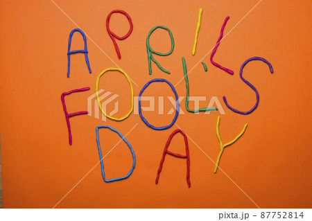 Funny font first april fools day written in plastecine of different colors. 87752814