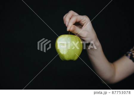 green apple in hands of woman green apple in hands of woman 87753078