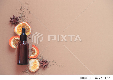 Glass dropper bottle of pure organic vegan skincare serum showing sustainable comfort  87754122