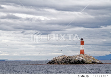 Les Eclaireurs Light House on rocky island on the Beagle Channel - Argentina 87754367