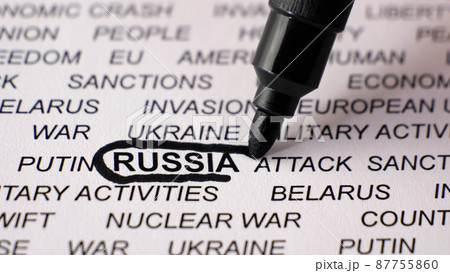 Closeup shot of RUSSIA written on white paper with a black circle around it. 87755860