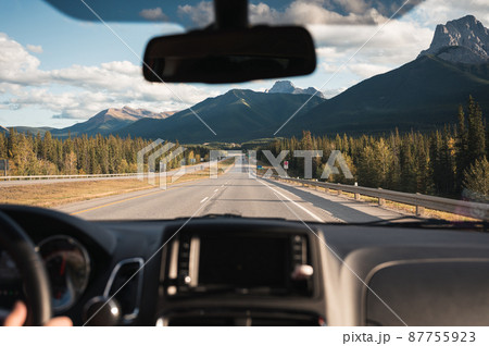 Road trip with car driving with rocky mountains on highway in Banff national park Road trip with car driving with rocky mountains on highway in Banff national park 87755923