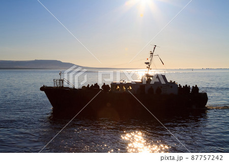 Passenger boat sailing on the estuary 87757242