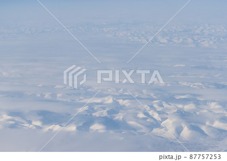 Aerial view of snow-capped mountains 87757253