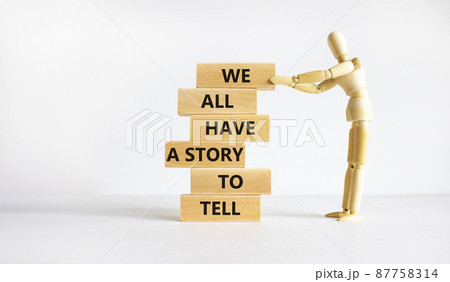 We all have a story to tell symbol. Wooden blocks with words 'We all have a story to tell'. Businessman model. Beautiful white background. Business, popular quotation concept. Copy space. We all have a story to tell symbol. Wooden blocks with words 'We all have a story to tell'. Businessman model. Beautiful white background. Business, popular quotation concept. Copy space. 87758314