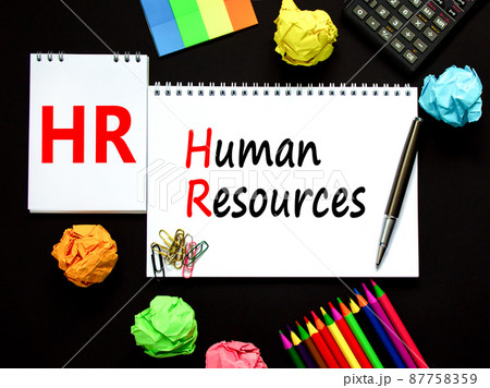 HR Human resources symbol. Concept words HR Human resources on white note. Metallic pen, calculator, pencil. Beautiful black background. Business and HR human resources concept. 87758359