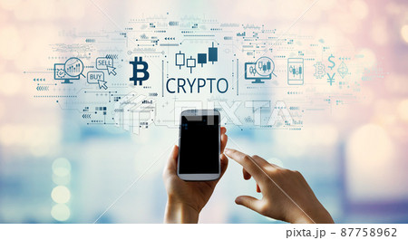 Crypto Trading theme with person using smartphone Crypto Trading theme with person using smartphone 87758962