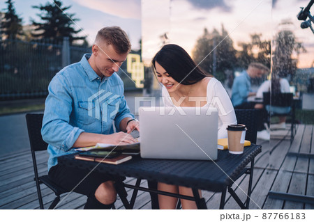 Smiling couple working on project together Smiling couple working on project together 87766183