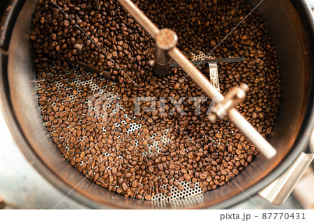 Roasted coffee beans in a cooling machine Roasted coffee beans in a cooling machine 87770431