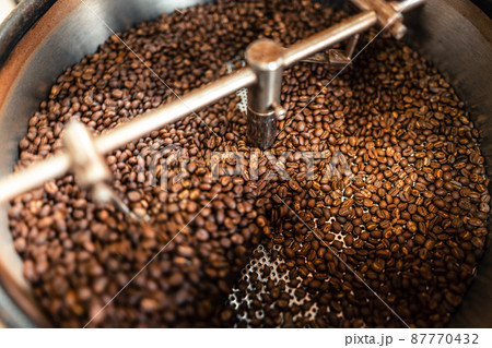 Roasted coffee beans in a cooling machine Roasted coffee beans in a cooling machine 87770432