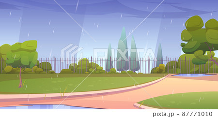 Park at rainy day, city area with paths and fence 87771010
