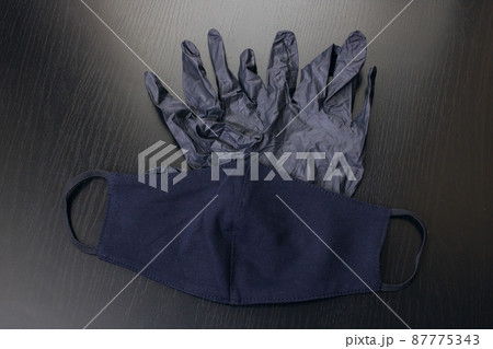 Black gloves and a medical mask closeup 87775343