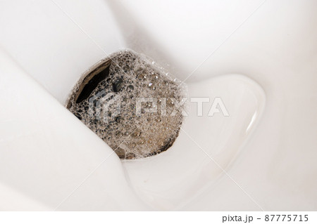 White toilet bowl and water with foam 87775715