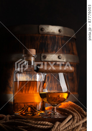 Glass and bottle with cognac 87776003