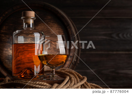 Glass and bottle with cognac 87776004