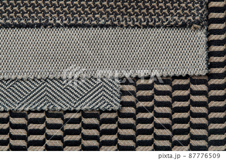 The background consists of several types of colored tiles with different patterns on gray tone The background consists of several types of colored tiles with different patterns on gray tone 87776509