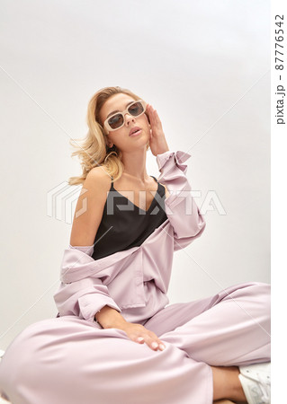 Beauty portrait of elegant attractive blonde woman wearing stylish sunglasses. Fashionable hairstyle. Beauty portrait of elegant attractive blonde woman wearing stylish sunglasses. Fashionable hairstyle. 87776542