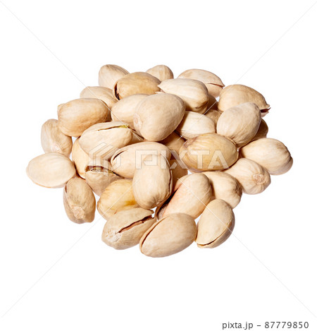 Pistachios heap isolated on white background. Pistachios heap isolated on white background. 87779850