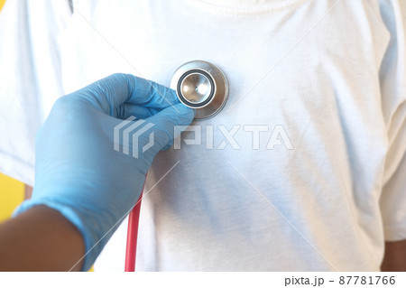 Doctor using a stethoscope checking child body, close up Doctor using a stethoscope checking child body, close up 87781766