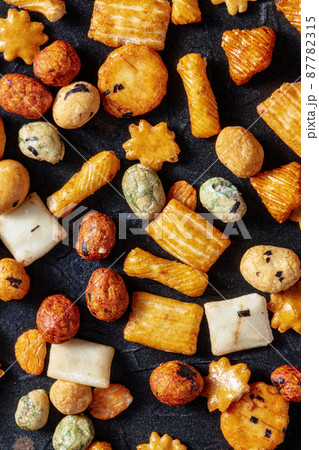 Japanese rice crackers assortment on a black slate background 87782315