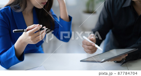 Group of IT consultant working by digital tablet and management big data and analyze financial document of company. Group of IT consultant working by digital tablet and management big data and analyze financial document of company. 87784704
